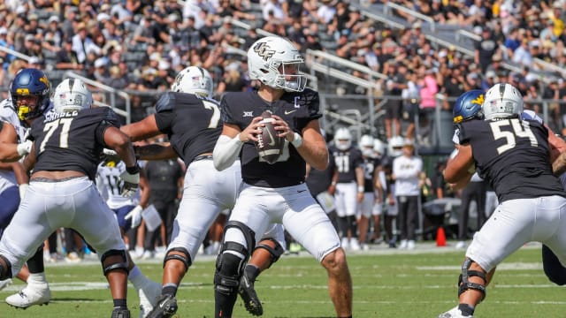 Oct 28, 2023; Orlando, Florida, USA; UCF Knights quarterback John Rhys Plumlee (10) prepares to pass during the second quarter against the West Virginia Mountaineers at FBC Mortgage Stadium. 